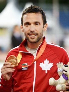 Toronto, ON - Aug 12 2015 - Guillaume Ouellet receives his Gold Medal for the Men's 1500m T13 in the CIBC Athletics Stadium during the Toronto 2015 Parapan American Games (Photo: Matthew Murnaghan/Canadian Paralympic Committee)